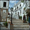 Main street continues to the left. TThe stepped street to right is steeper but shorter route to our villa.  Also, no cars.