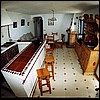 Our villa, main living area. When we were there, the hutch had been replaced by another couch.