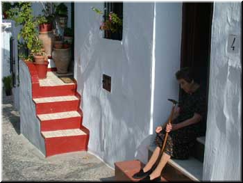 Frigiliana - doorway. The brightly painted steps are unusual in Frigiliana.