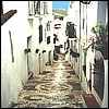 Frigiliana - a major street in the old village. Not a driving street - note the steps!