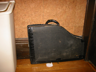Marxophone in case, behind door to den
